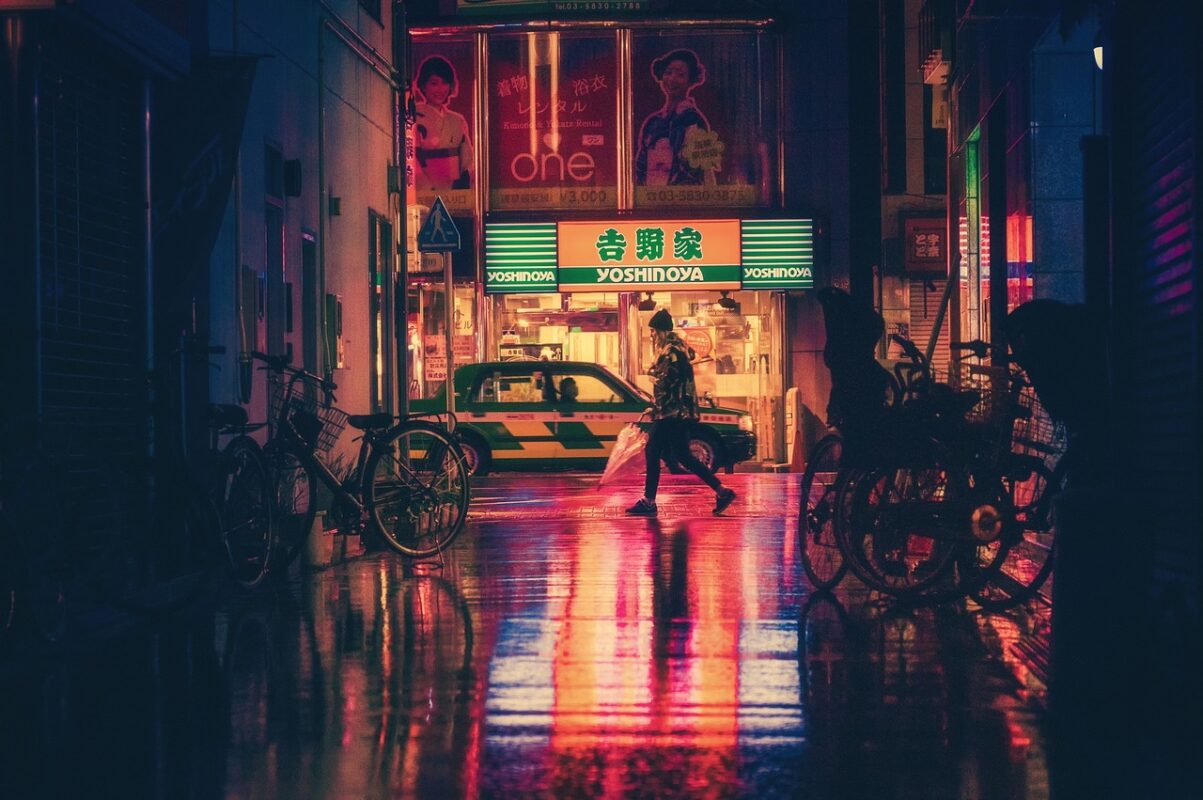 A cyclist riding at night in the city